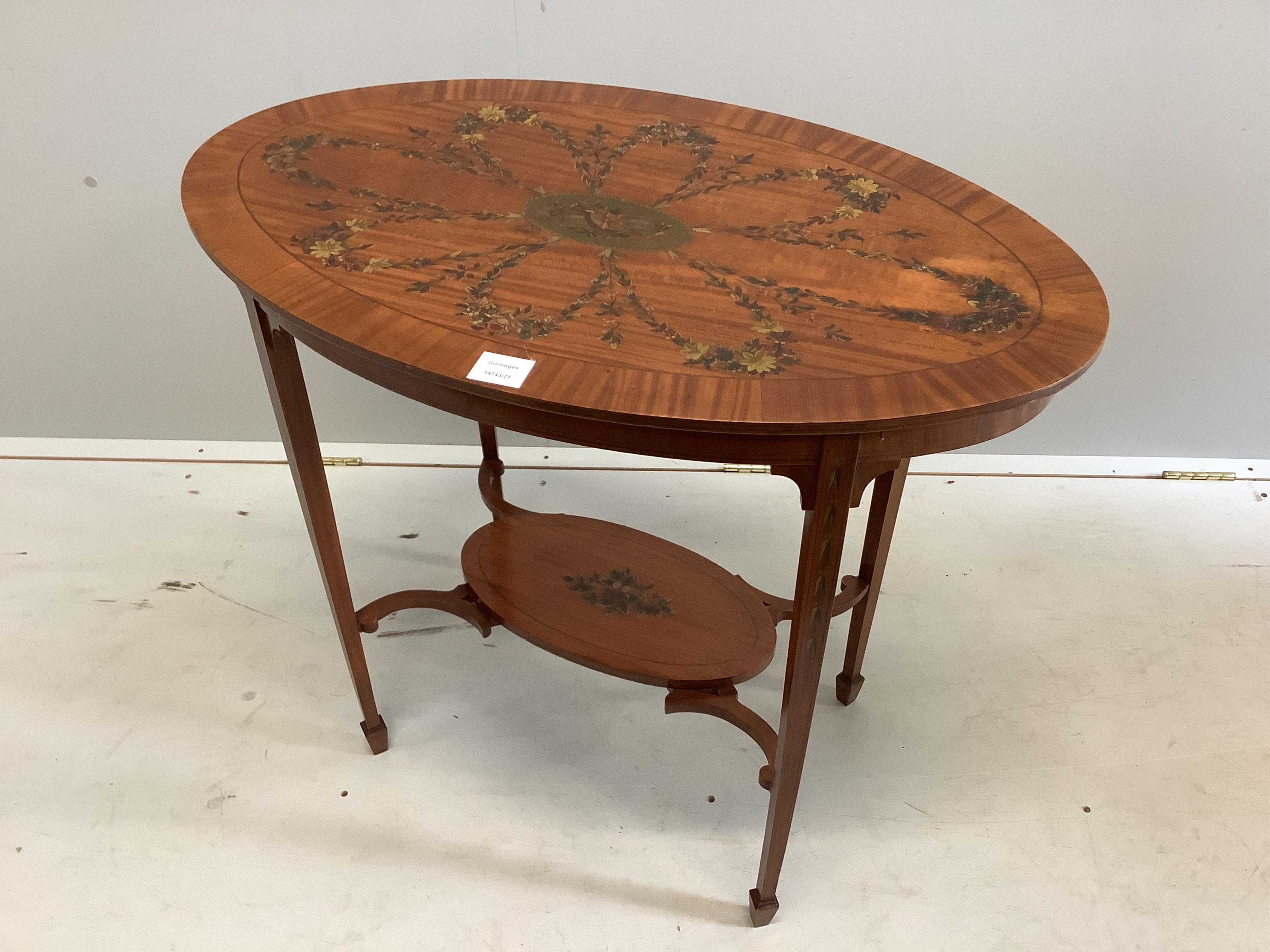 An Edwardian Sheraton Revival oval painted satinwood occasional table, width 81cm, depth 49cm, height 70cm. Condition - fair